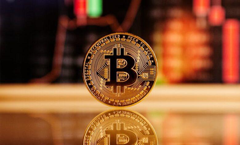 Golden Bitcoin standing in front of a financial chart, reflecting the cryptocurrency market volatility.