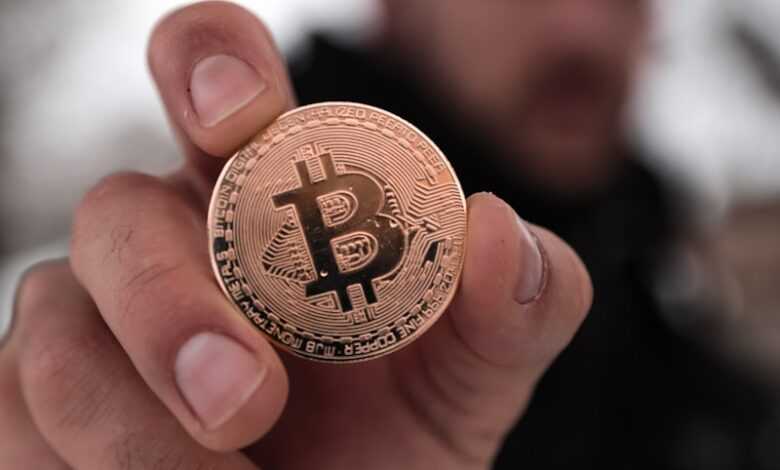 a person holding a coin