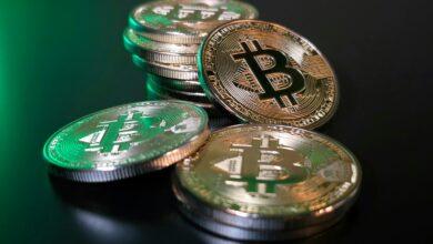 a pile of bitcoins sitting on top of a table