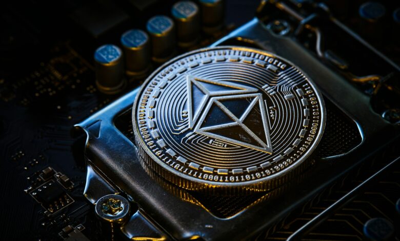 a close up of a computer chip with a symbol on it