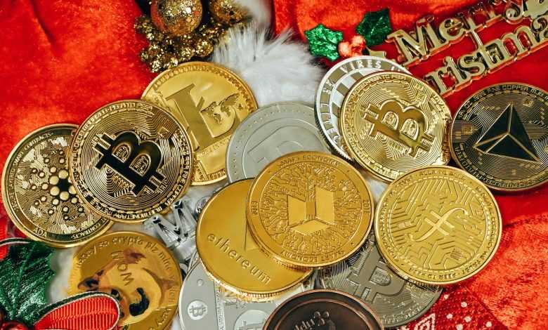 a pile of gold and silver coins sitting on top of a red blanket
