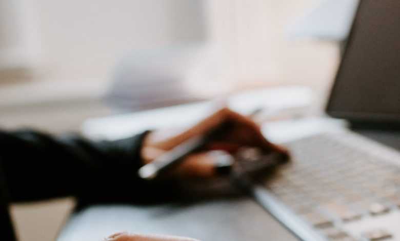 person using black and silver laptop computer