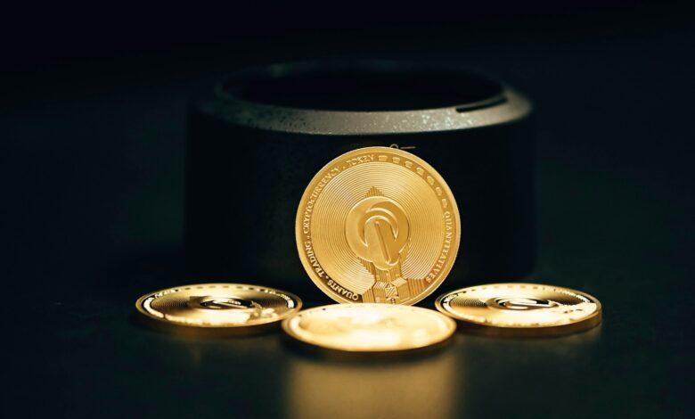 a gold coin sitting on top of a black table