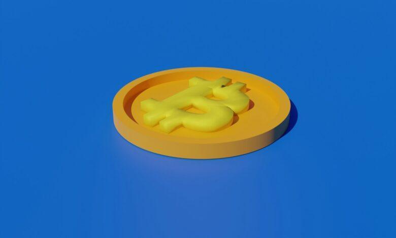 a yellow plastic object sitting on top of a blue surface